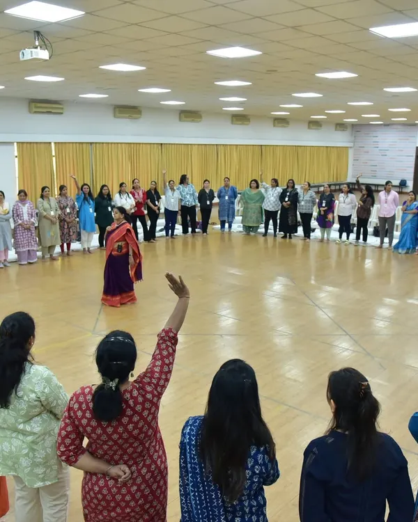This is the heart of what I do. I create a sacred circle where we can connect, play, and discover the stories within us. Here, I am leading a workshop for educators, filling the space with energy and shared experience.