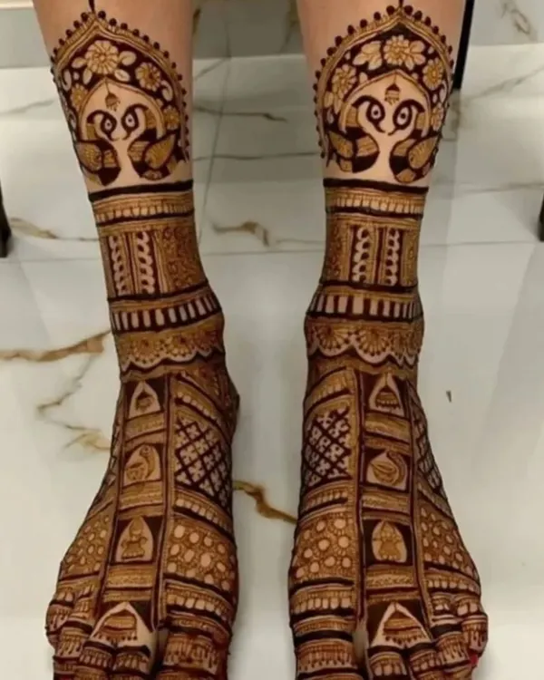 A stunning full-coverage bridal foot design with peacock motifs. This design is intricate and covers the feet beautifully, perfect for a bride.