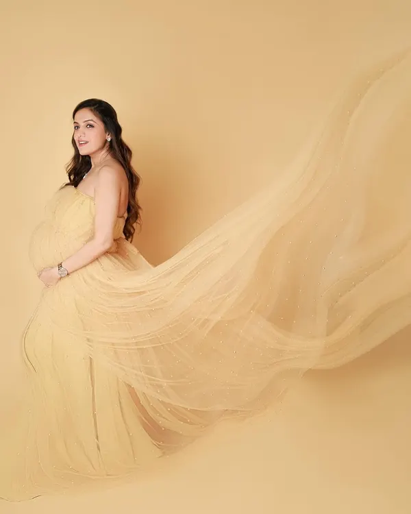 For the mamas who want to feel like a queen, a flowing gown session is pure magic. The way the fabric catches the air feels like we are capturing a dream.