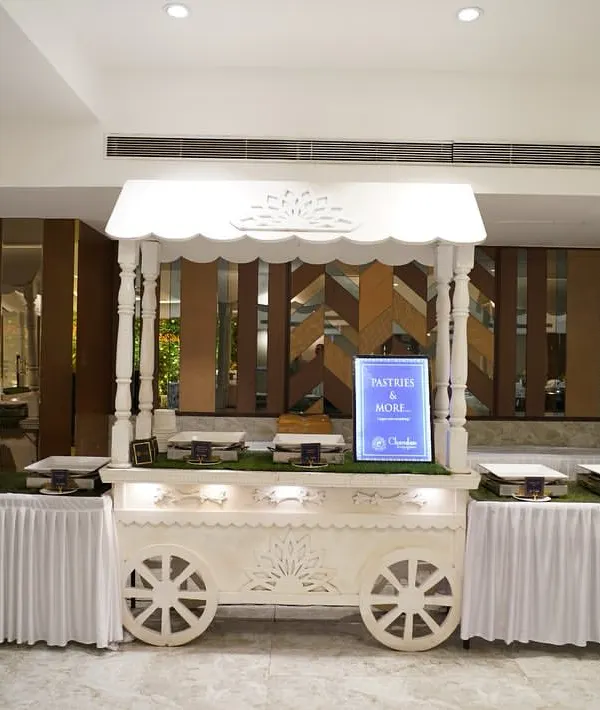 My signature white food cart, designed to be both functional and a beautiful decor piece. It can be customized for any food station, like this one for a Haldi ceremony.
