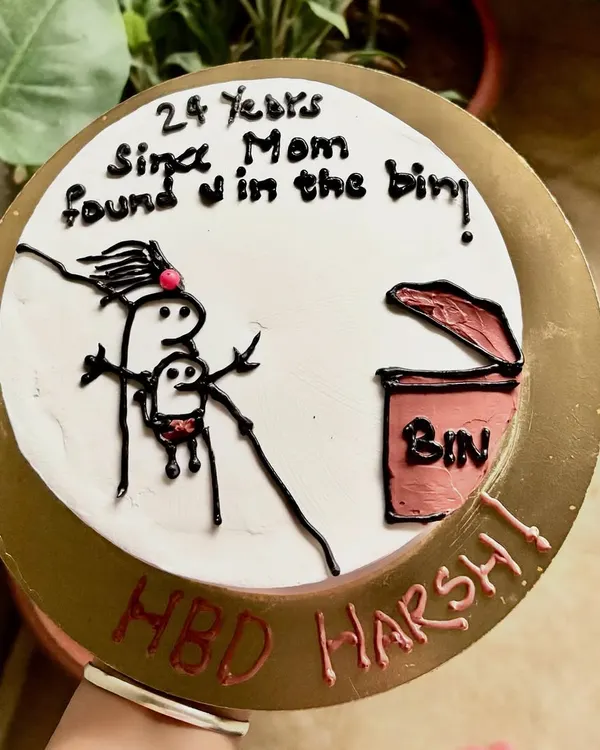 A top-down view of the hilarious "found in the bin" cake. This is for friends with a very specific sense of humor.