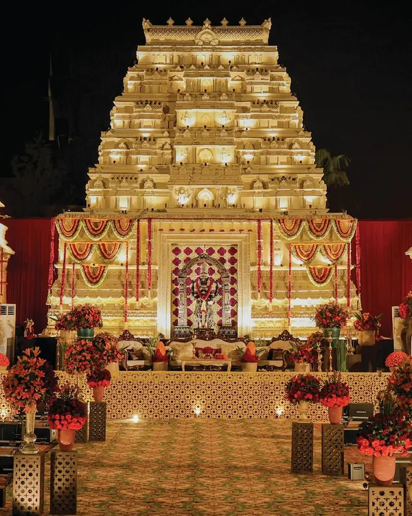 I transform vast spaces into sacred sanctuaries. This recreation of the Mysore Palace Mandira stands as a testament to my team's craftsmanship, creating not just a structure of grandeur, but a sanctum that radiates divinity and devotion for a truly monumental wedding ceremony.