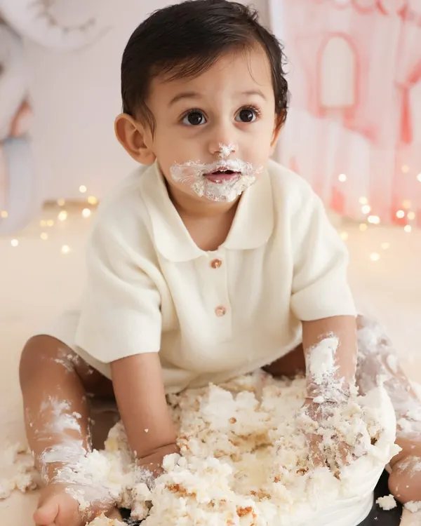 This is what a first birthday is all about. The pure, messy joy of digging into a cake for the first time. I love capturing the surprised expressions and happy giggles during my cake smash sessions.