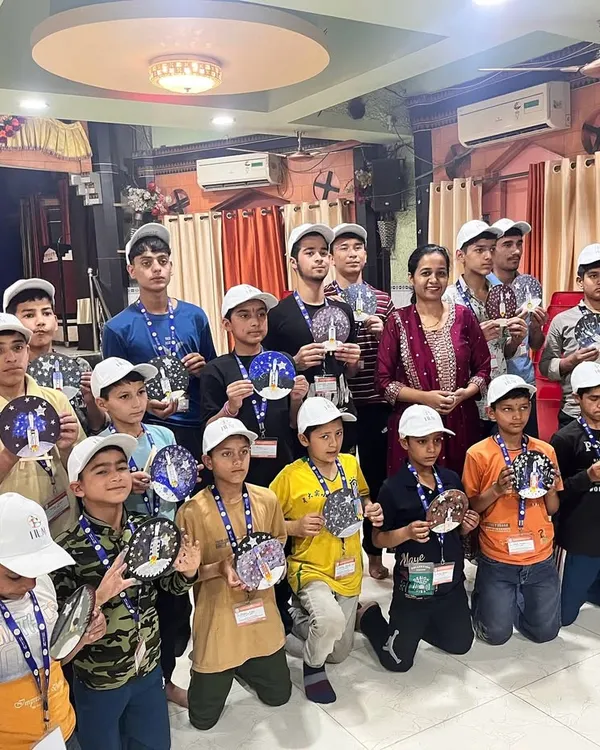 This group photo with students from the Hum Foundation is one of my most cherished memories. Each child is holding their unique creation from our Chandrayaan kit workshop, a testament to their creativity and resilience.