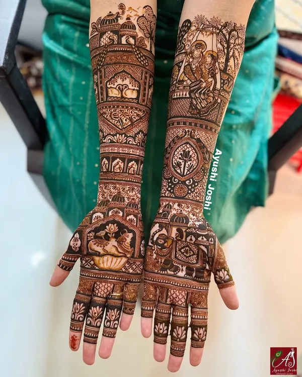 A full bridal design dedicated to the divine love of Radha and Krishna. One arm features their portrait, while the other depicts symbols associated with them, like cows and palace gardens.