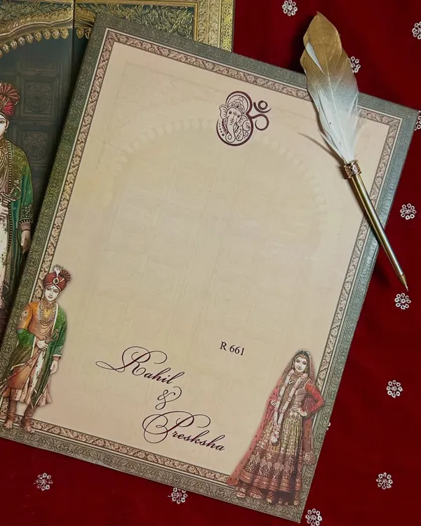 A simple yet beautiful insert for writing a personal note, featuring a feather quill and classic calligraphy with the couple's names.