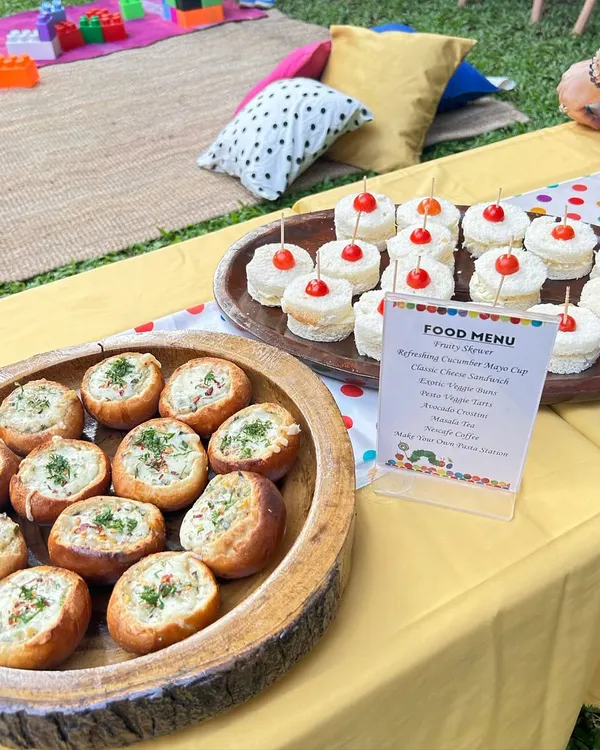 A themed food menu and delicious appetizers for a 'Very Hungry Caterpillar' party. I love incorporating the party's theme into the food presentation.