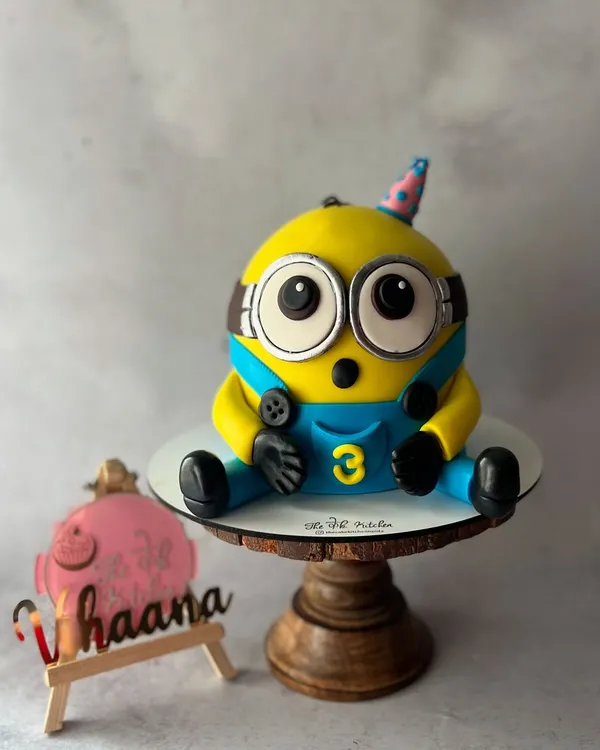 Here's Bob the Minion, ready for a birthday party. I sculpted this 3D cake entirely from fondant to capture his cute and surprised expression, complete with his little party hat.