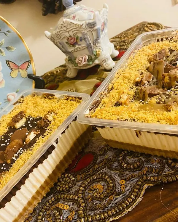 My bestseller, the Twixter dessert, ready to go out in trays. It's a creamy, dreamy dessert with layers of chocolate, caramel, and crunchy Twix pieces.