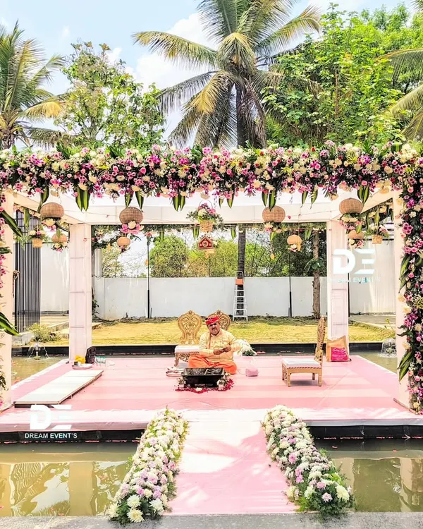 This is what dreams are made of. I designed this floating mandap to create a truly magical moment, with a lush floral canopy that seems to hover over the water. It’s a perfect example of how I can transform a unique wedding venue into an unforgettable, romantic paradise.