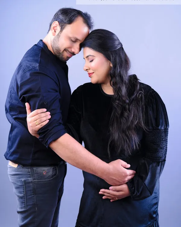 This is what it's all about: the quiet connection and support. A simple studio portrait of a couple embracing captures the tenderness of this shared journey.