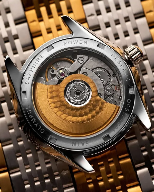 The heart of the watch. I love shooting exposed case backs because they reveal the incredible engineering inside. For this Argos Olympus, I used a Hasselblad X2D to capture every gear and jewel with absolute clarity, laying it on a bed of watch links to create texture and context.