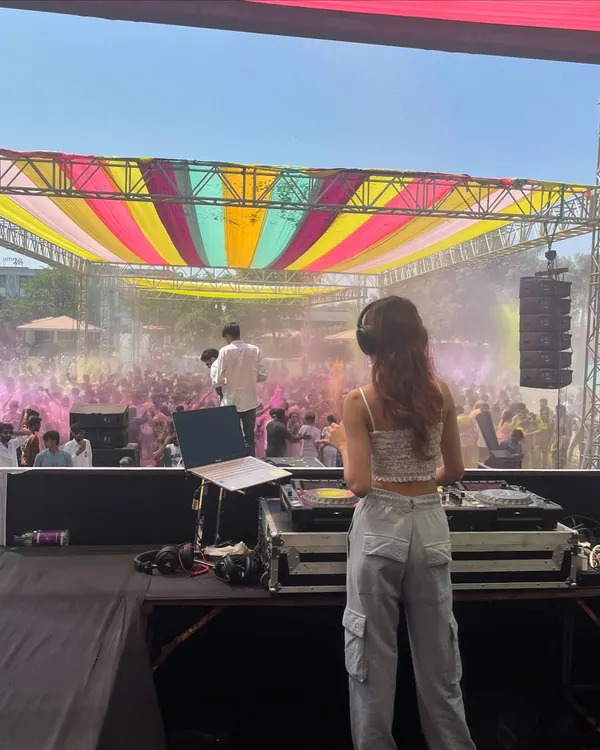 This is the energy I bring to every event. Here I am, playing for a massive crowd at a vibrant Holi festival, creating an unforgettable daytime party experience.