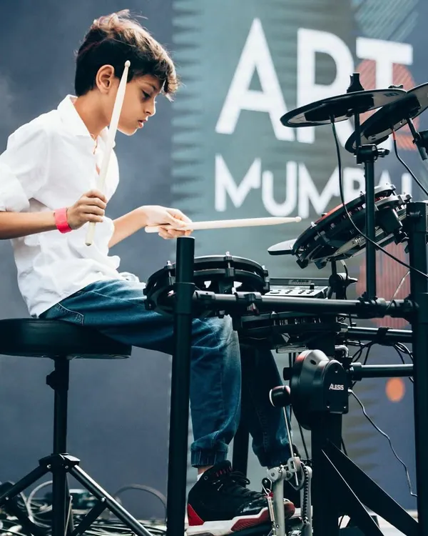 A young drummer completely in his element during a performance at Art Mumbai. We love seeing our students find their rhythm and passion on stage.