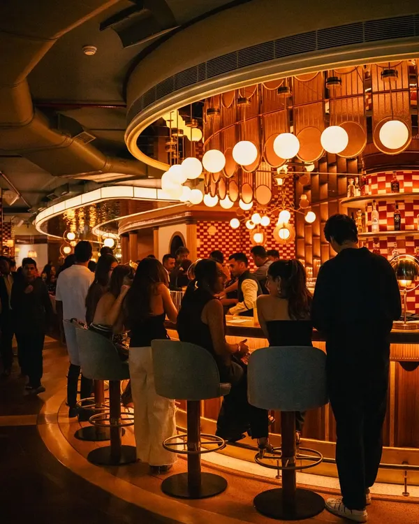 The energy at the bar is contagious. It's the heart of the restaurant, where conversations flow, glasses clink, and our bartenders put on a show.