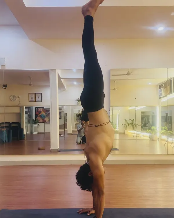 The practice of Adho Mukha Vrksasana, or handstand, requires abhyasa, which is dedicated and consistent effort. Here, I demonstrate the alignment and core engagement needed to hold the pose with stability and grace.