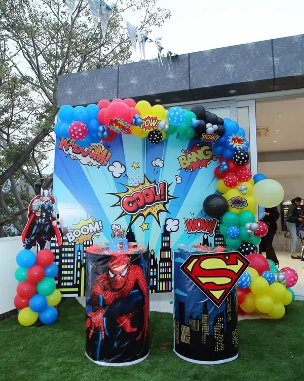 A classic superhero setup featuring a comic book style backdrop with Spiderman and Superman pedestals. I design these photo corners to be the center of attention, perfect for capturing those powerful hero poses.