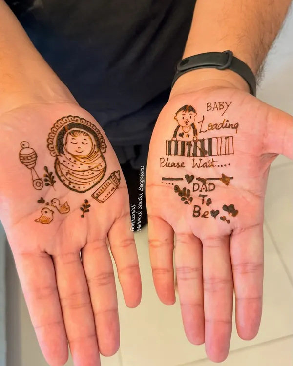 A special design for the dad-to-be. This fun mehendi includes a 'Baby Loading' bar and a cute drawing of a baby in a cradle.