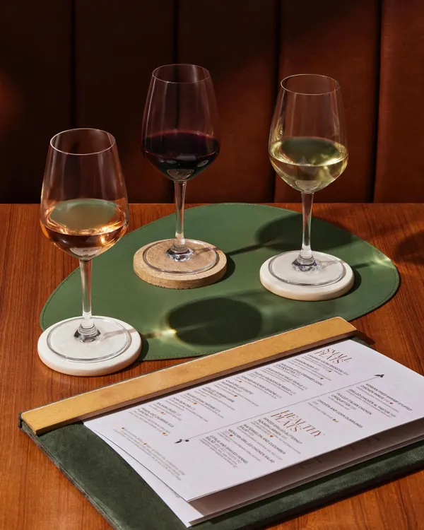 This is the core of our wine philosophy. A selection of red, white, and rosé, ready to be poured by the glass, inviting you to explore pairings and find a new favorite without ordering the bottle.