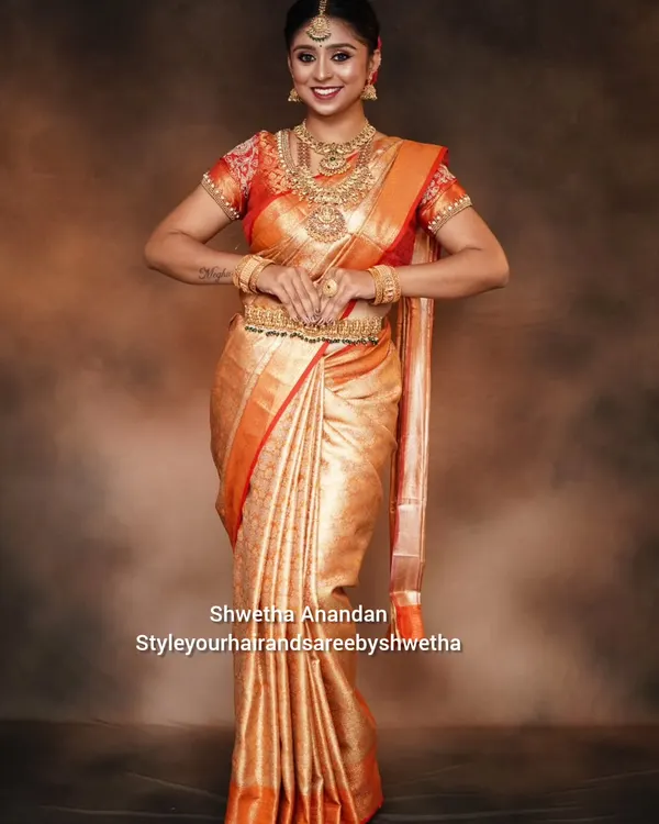 This is the magic I love to create. A beautiful bride, draped in a traditional Kanjivaram silk saree, ready for her big day. My focus is always on creating those perfect, sharp pleats and a silhouette that feels as good as it looks.