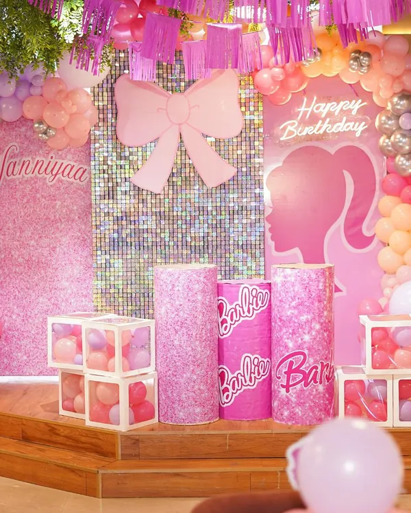 A stunning Barbie-themed birthday setup, complete with a shimmering backdrop, custom pedestals, and a cascade of pink and pastel balloons. We design every element to create a picture-perfect party scene.