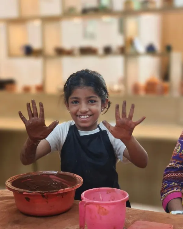The pure joy of getting your hands messy with clay. This young participant can't hide her excitement during our one-day workshop, a perfect introduction to the world of pottery for all ages.