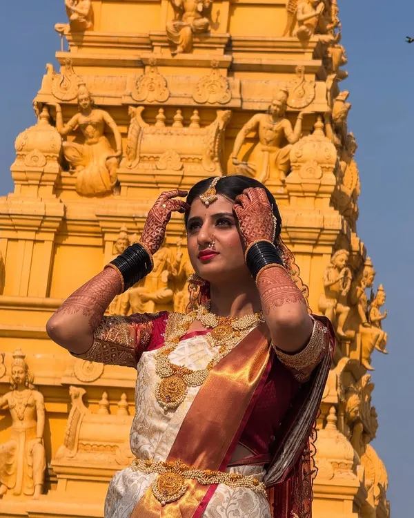 This is the quintessential South Indian bridal look I love to create. The focus is on traditional elegance, with makeup that complements the beautiful silk saree and temple jewelry, set against a stunning backdrop.