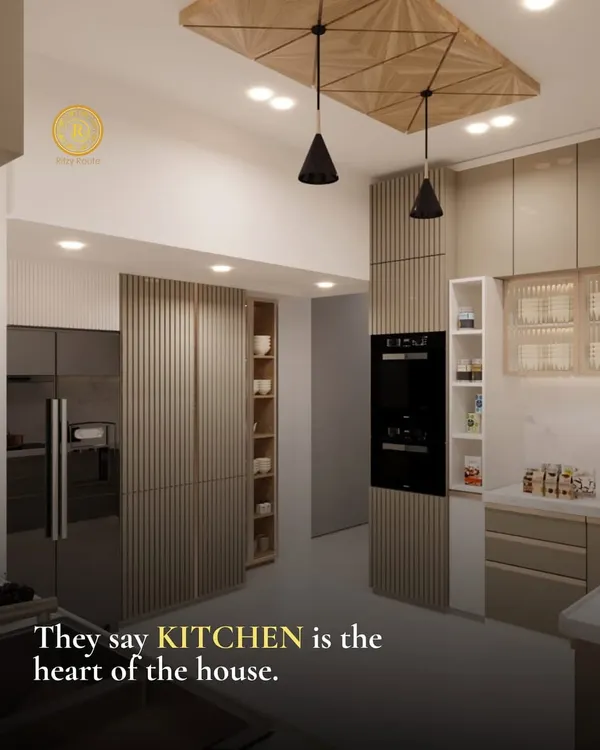 They say the kitchen is the heart of the house, and I design them accordingly. This space features seamless, fluted cabinetry, integrated appliances, and a unique wooden ceiling detail with pendant lights, blending warmth with modern efficiency.