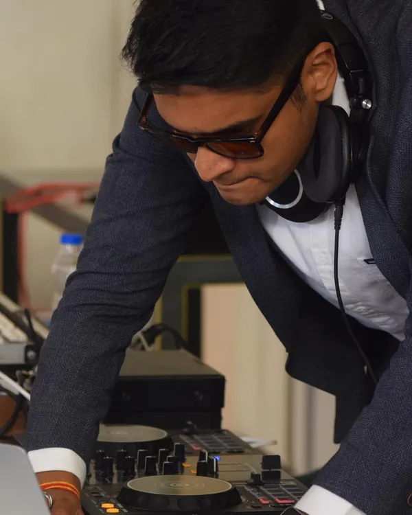 Focused on the mix. Every event gets my full attention as I blend tracks and adjust levels to create a seamless musical journey for the dance floor.