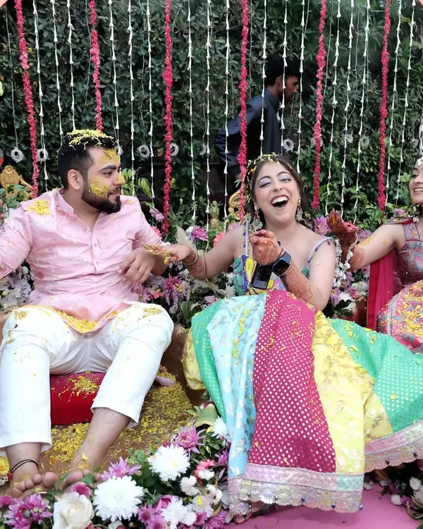 The joy of a Haldi ceremony is infectious. Here, friends and family shower the couple with flower petals and turmeric, and I capture the genuine laughter and vibrant colors of this beautiful pre-wedding ritual.