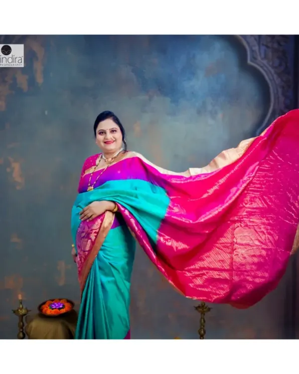 A mother-to-be glows in a vibrant, traditional saree during her maternity photoshoot in my studio. I love combining our rich heritage with this beautiful milestone, creating timeless portraits that feel both royal and deeply personal. This is more than a photo; it's the celebration of a new beginning.