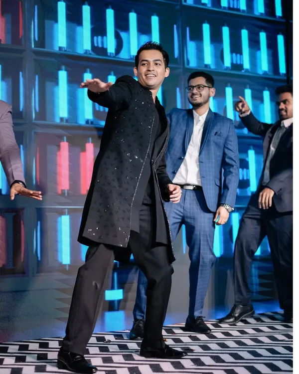 The groom takes center stage for his performance. We designed this dynamic LED backdrop and stage to make sure the groom's squad performance was a highlight of the Sangeet.