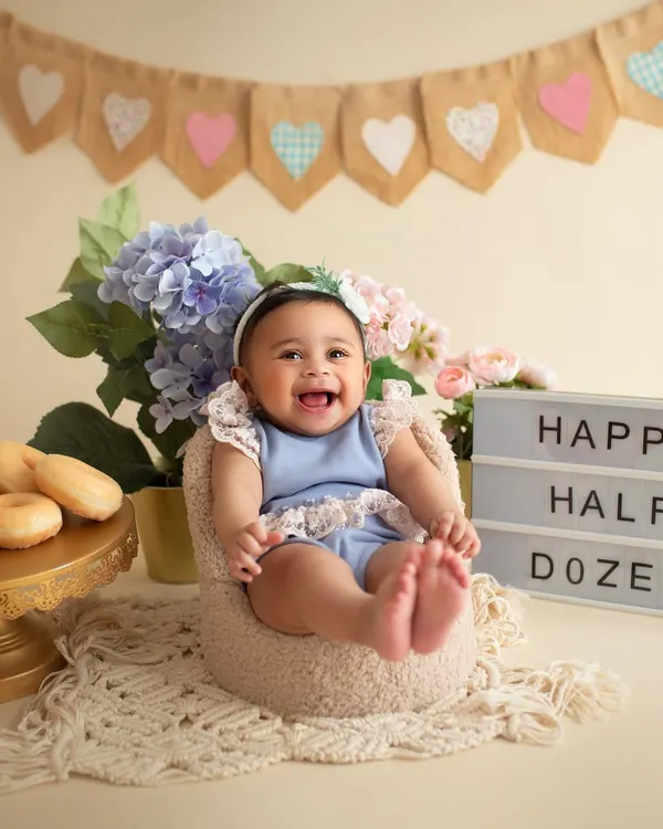 Happy Half Dozen! A half-birthday is a huge deal, and we celebrated with this adorable donut-themed setup. Look at that joyful laugh!