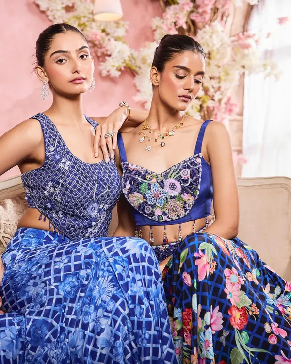 A campaign image for designer Krisha Sunny Ramani, featuring two models in coordinated blue ensembles. I created harmonious makeup looks with soft smokey eyes and glowing skin to complement the intricate beadwork.