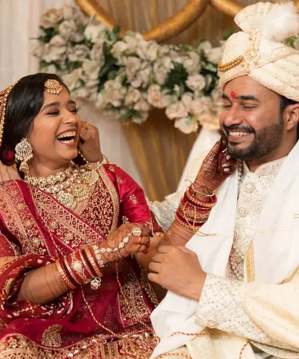 A candid moment of pure joy and laughter between the bride and groom. These are the unscripted memories we love to capture.