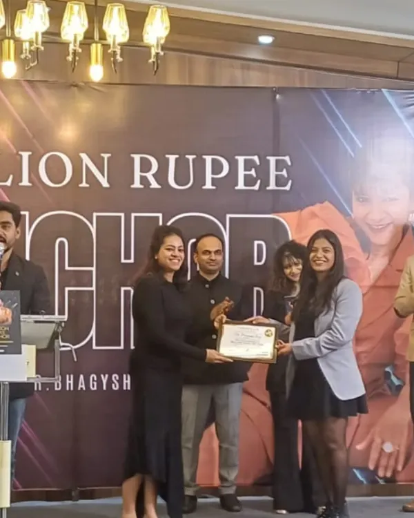 A grateful moment receiving an award for being the "Best Anchor." This recognition inspires me to continue raising the bar at every event I host.