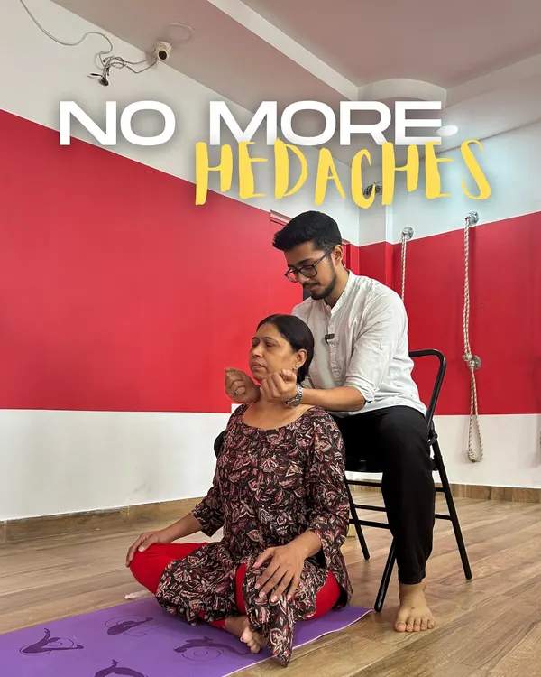 Headaches are often a direct result of tension in the neck and shoulders. In my cervical workshops, I use gentle, hands-on techniques to release this built-up stress. Here, a student finds relief through a supported neck release using a chair.