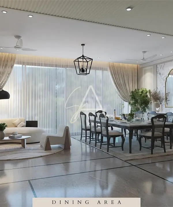 This open-plan living and dining area is designed for modern family life. A curved sofa defines the lounge space, while large windows and sheer curtains keep the entire area feeling bright, airy, and connected.