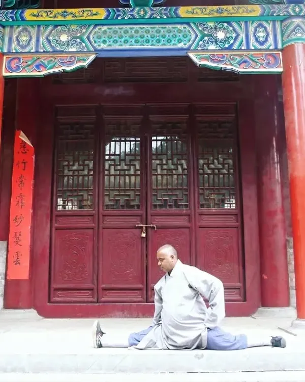 This is the result of discipline and correct training. My Shaolin fitness routine focuses on scientific methods to build deep, functional flexibility and strength, making poses like the full split achievable through consistent practice.