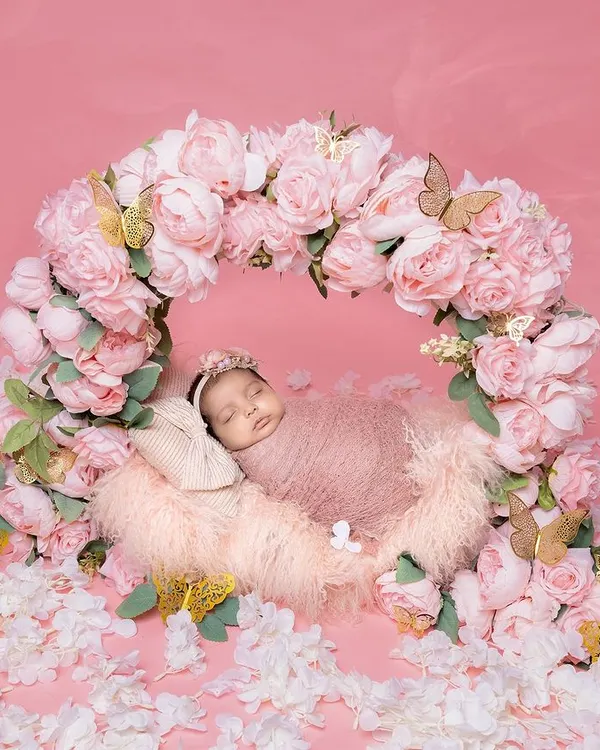 Wrapped in sweetness and surrounded by blooms, this little angel is dreaming of her beautiful journey ahead. This floral-wreath setup is one of my favorites for a classic, beautiful newborn portrait.