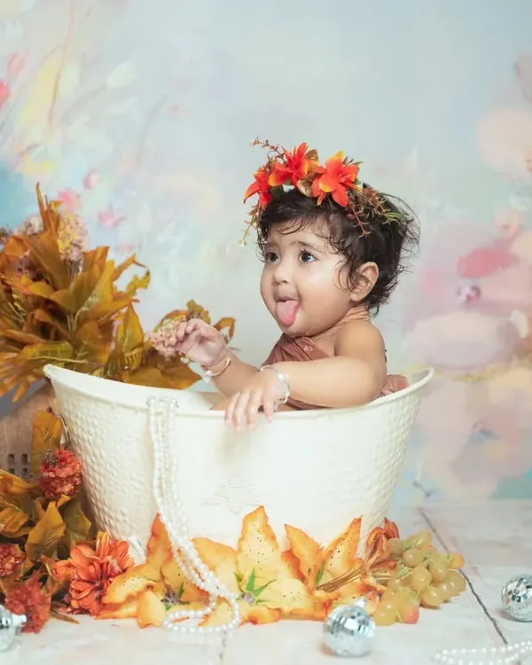 The cheeky expressions are the best part of our water splash sessions. This little one is having a blast playing in the tub.