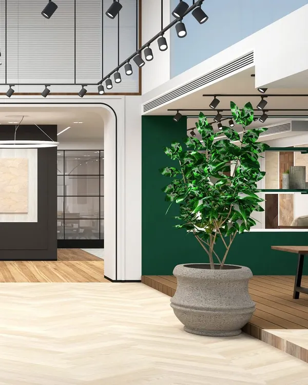 This stunning render captures our initial vision for the showroom, blending warm herringbone floors with a bold green feature wall and dramatic track lighting. Renders are a crucial step in materializing our concepts.