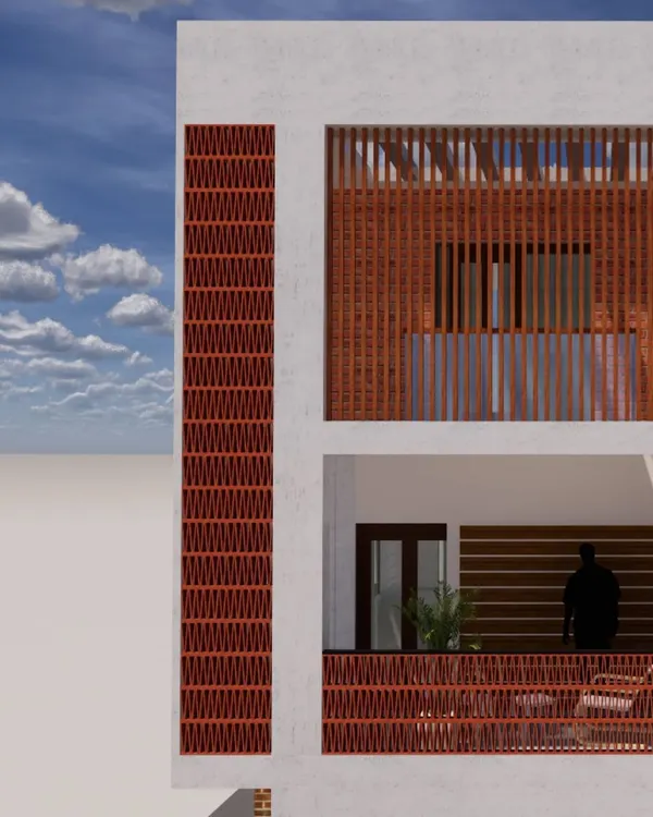 A design detail of a residential building facade featuring terracotta jali work. This traditional material not only adds aesthetic warmth and texture but also provides natural ventilation and shade, blending heritage with modern architectural needs.