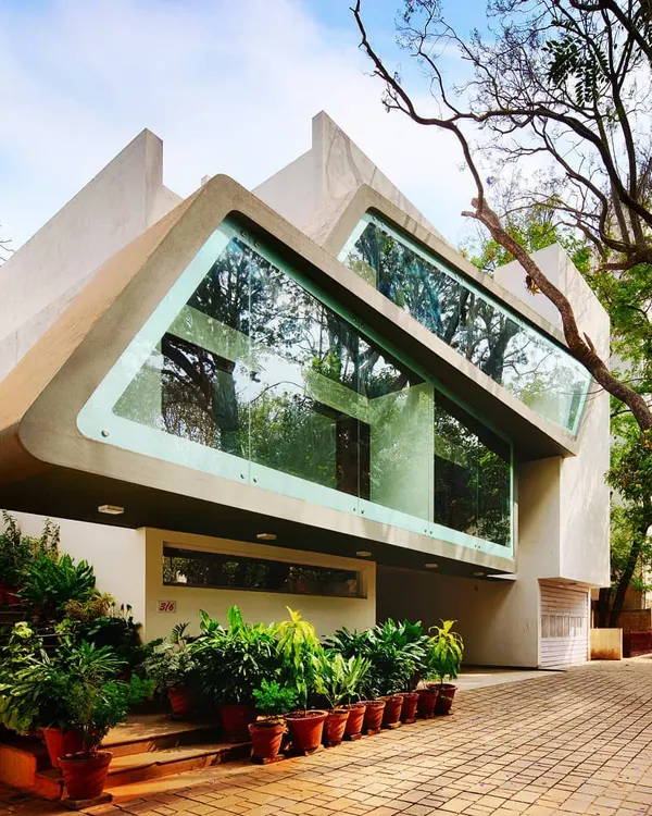 This is our Mobius Home project in Bangalore. We designed the unique, futuristic facade as a conscious effort to conserve the meandering tree branches in the surrounding neighborhood, creating a paradox of form and nature.