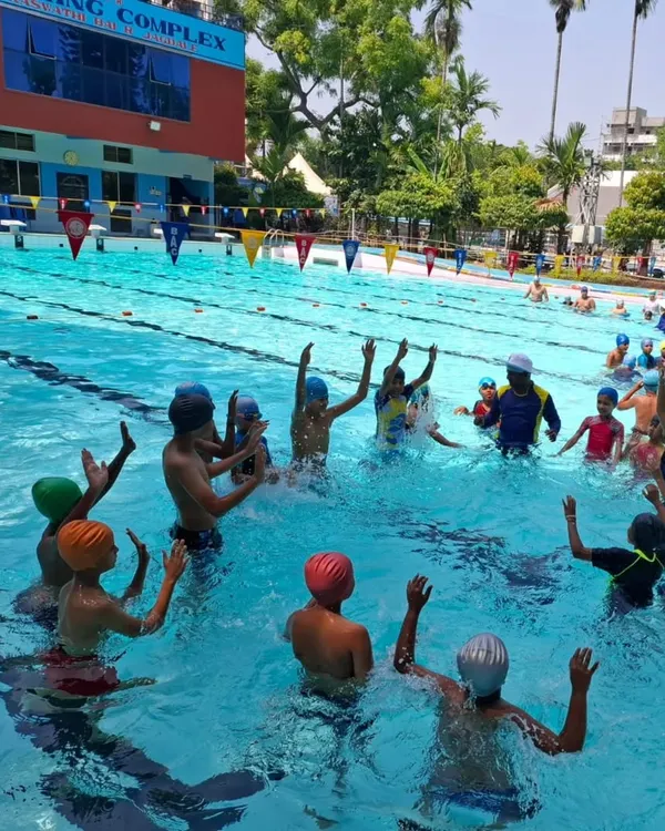 Our coaches making learning fun for kids in one of our international standard pools.