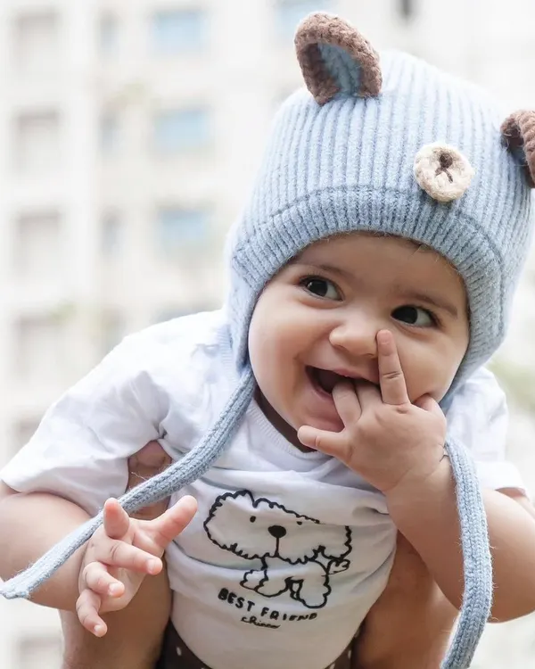 This is the kind of moment I live for. I believe the best prop for a baby shoot is their own infectious smile, and I patiently wait to capture that pure, unscripted joy.