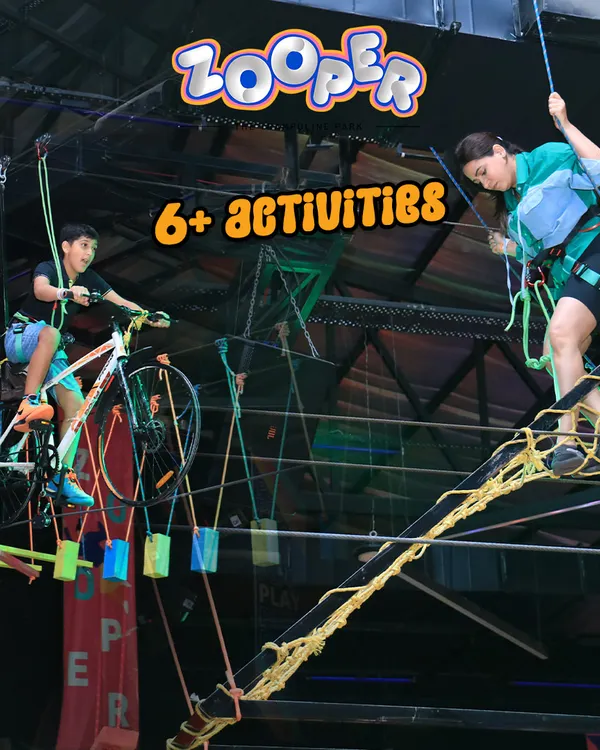We have over 6 different high-flying activities. Here you can see our sky cycling course and rope obstacle course, suspended high above the trampolines.