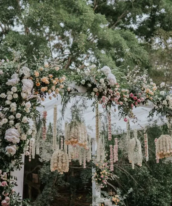 This elegant mandap is a fusion of contemporary and traditional design. We used a canopy of pastel florals and intricate hanging arrangements to create a dreamy, romantic space for the wedding ceremony.