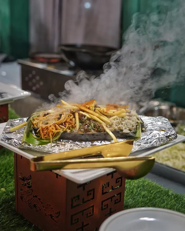 Sizzling platters speak louder than words. A freshly prepared sizzler, steaming and packed with flavor, ready to be served hot off the grill at your event.