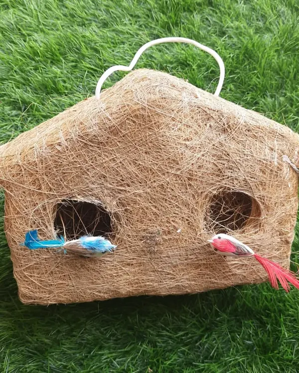 This is a new design for my handmade bird nests. This one is shaped like a little hut and is made from natural coir, providing a safe and cosy home for small birds.